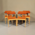 Vintage Space 4er-Set Mid Century Esszimmerstühle mit orangefarbenem Stoffbezug und hellem Holzgestell im Scandi-Stil