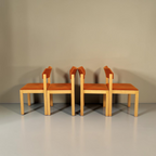 Vintage Space 4er-Set Mid Century Esszimmerstühle mit hellem Holzgestell und orangefarbenem Stoffbezug im Retro-Design