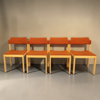 Vintage Space 4er-Set Mid Century Esszimmerstühle mit hellem Holzgestell und orangefarbenem Stoffbezug