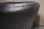 Vintage Space Koinor 2-Sitzer Sofa aus schwarzem Leder mit hochwertiger Textur und geschwungener Rückenlehne